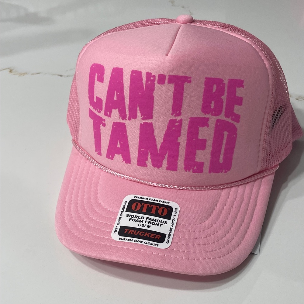 CAN’T BE TAMED Pink Trucker Hat with Bold Text